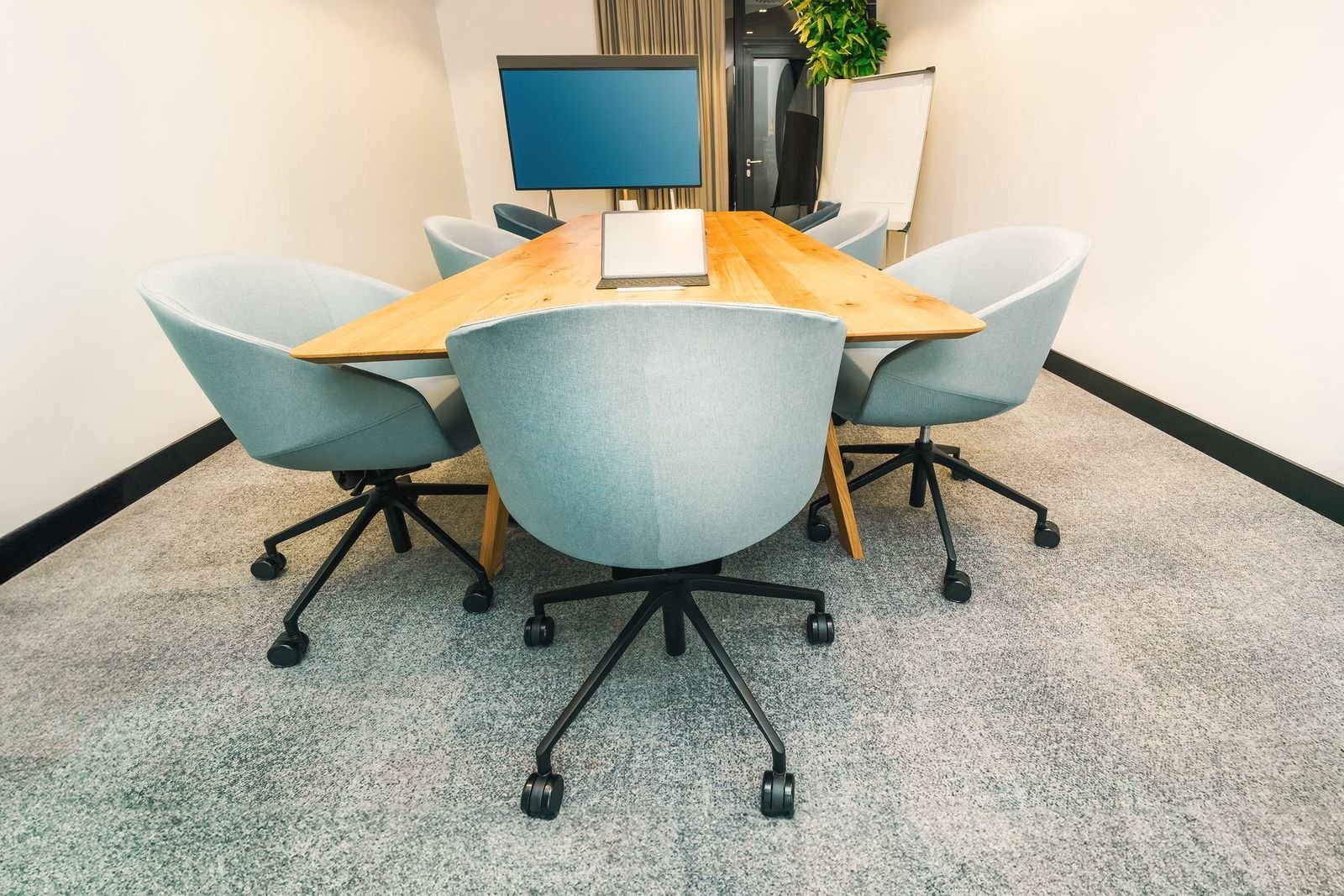 Meeting room set up with tables and chairs