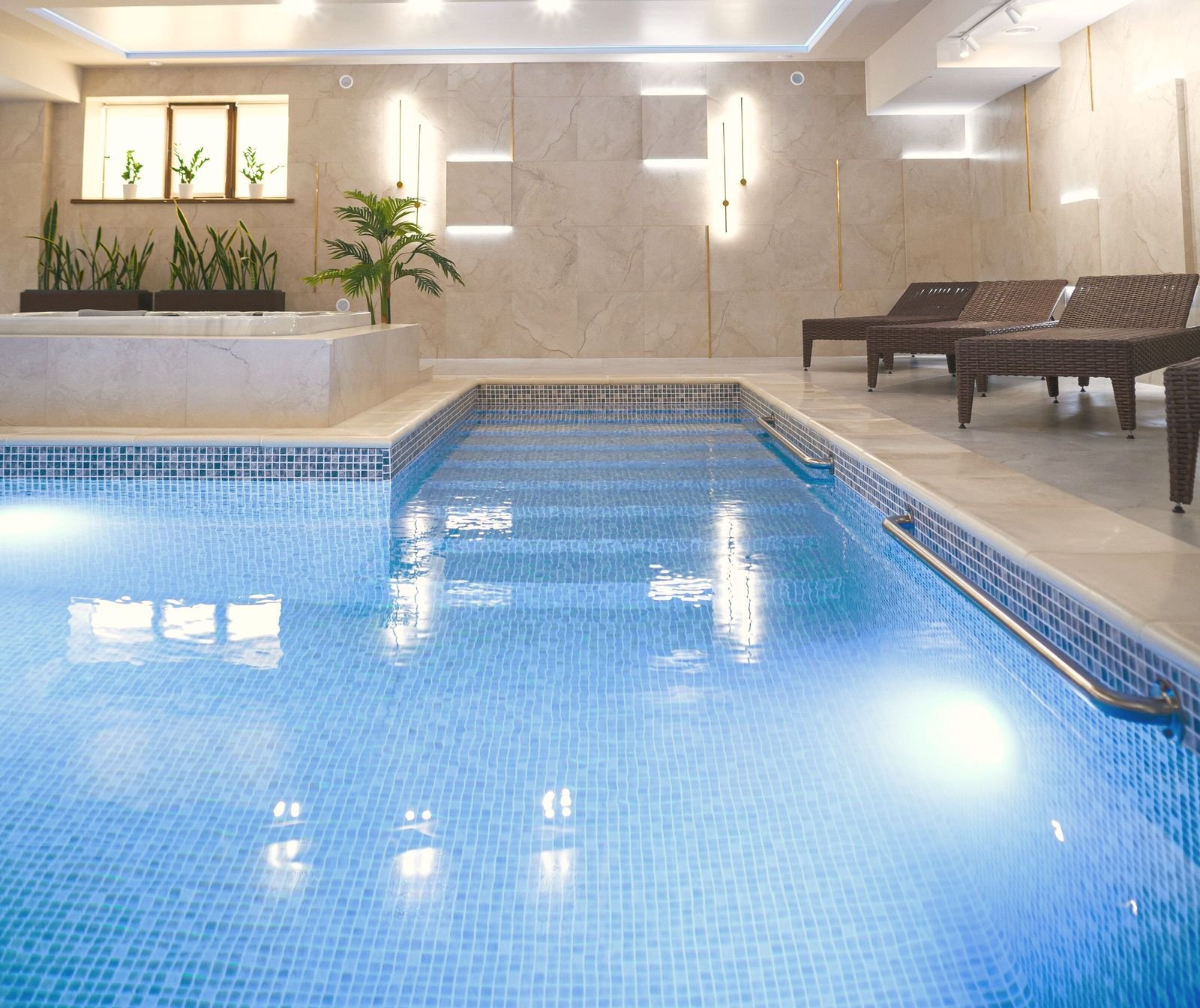 Heated indoor pool lit in the evening